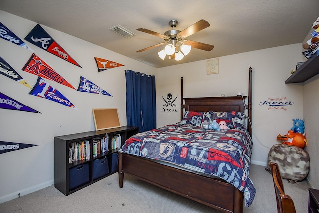 carpeted bedroom featuring visible vents, ceiling fan, and baseboards