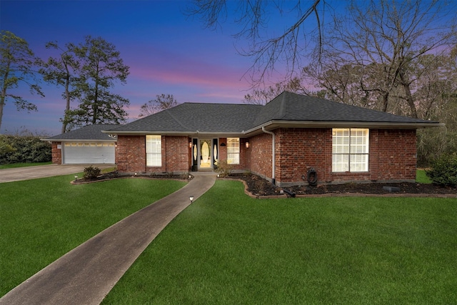 single story home featuring brick siding, roof with shingles, and a front yard