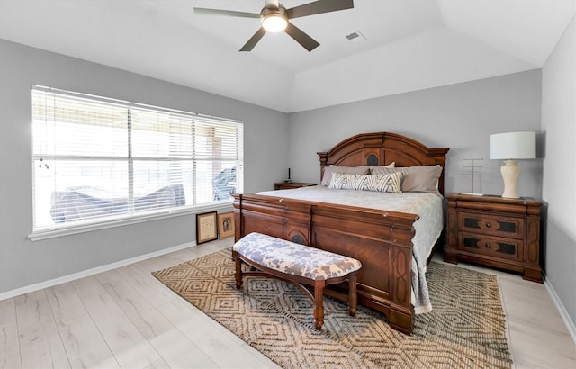 bedroom featuring a ceiling fan, lofted ceiling, visible vents, and baseboards