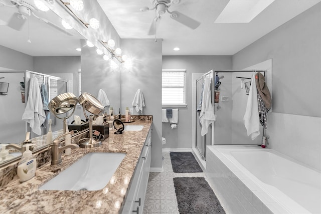 full bath featuring a garden tub, a sink, a ceiling fan, and a shower stall