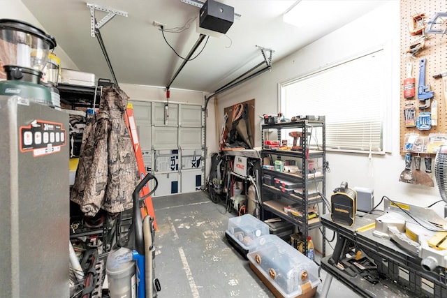 garage featuring a garage door opener and a workshop area