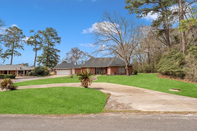 view of front of home with a garage, a front yard, concrete driveway, and brick siding