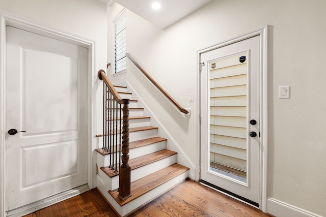 staircase featuring recessed lighting and wood finished floors