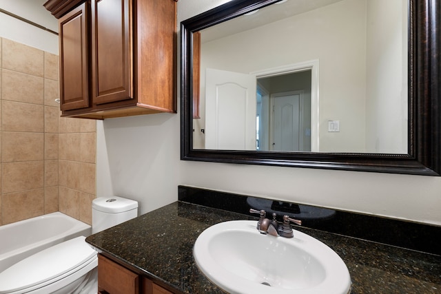 full bathroom with toilet and vanity