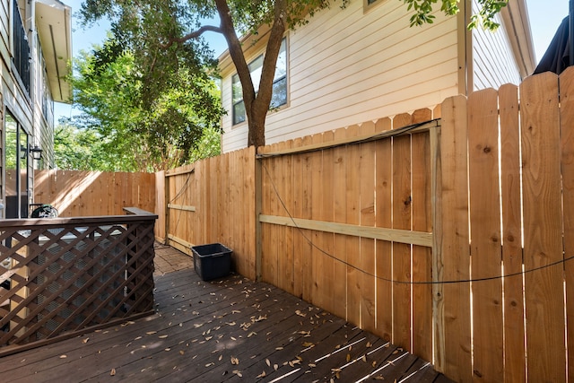 wooden deck featuring fence