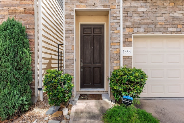 property entrance with stone siding