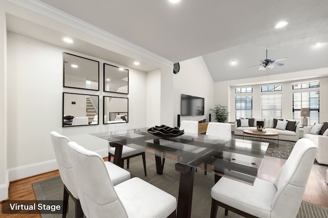 dining area with recessed lighting, a ceiling fan, vaulted ceiling, wood finished floors, and baseboards