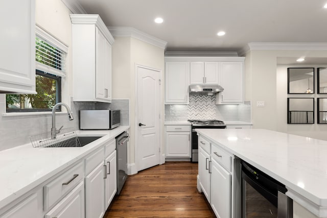 kitchen with white cabinets, wine cooler, stainless steel appliances, under cabinet range hood, and a sink