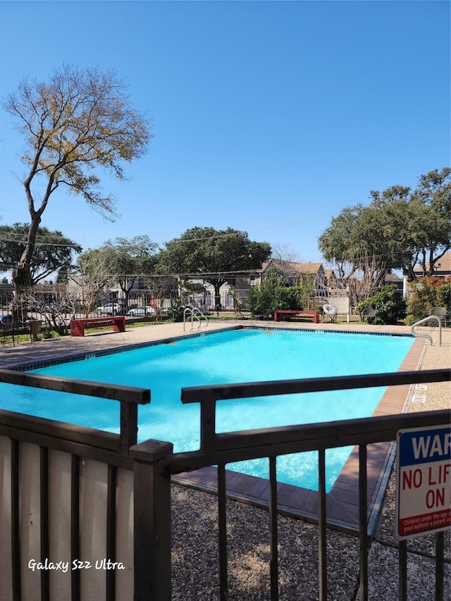 pool featuring fence