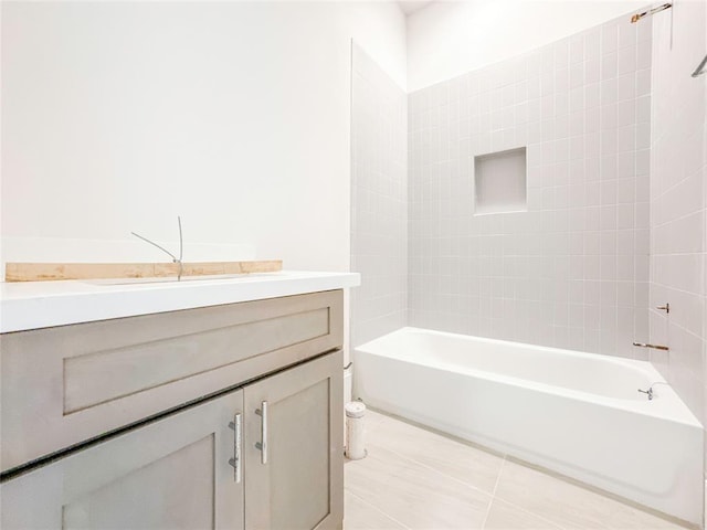 full bath featuring tub / shower combination, vanity, and tile patterned floors