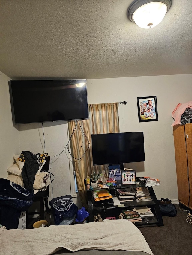 bedroom with carpet flooring and a textured ceiling