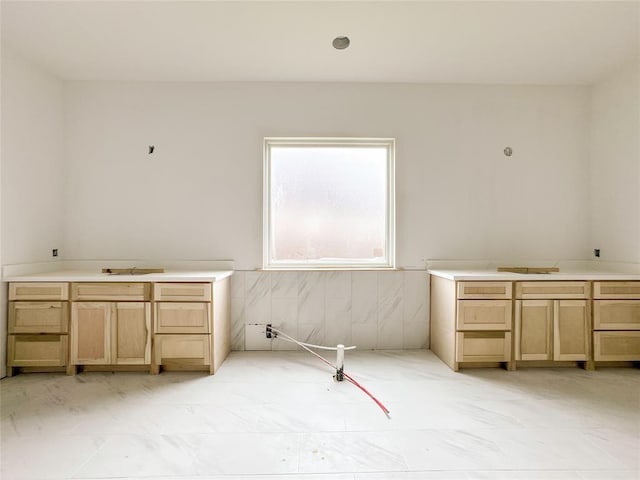 bathroom with marble finish floor