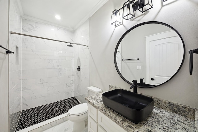 bathroom with toilet, marble finish floor, a shower stall, and crown molding