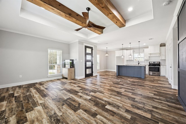 unfurnished living room with dark wood-style floors, baseboards, and beam ceiling