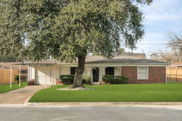 ranch-style home with driveway, a garage, fence, a front lawn, and brick siding