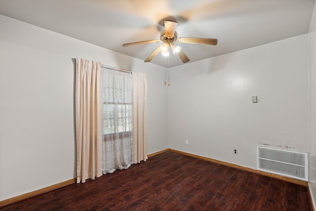 spare room featuring visible vents, ceiling fan, baseboards, and wood finished floors