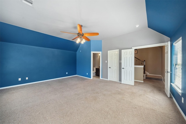 2405 Pebble Lodge Ln, Friendswood, TX 77546 - additional living space with vaulted ceiling, a ceiling fan, healthy amount of natural light, carpet flooring, and baseboards