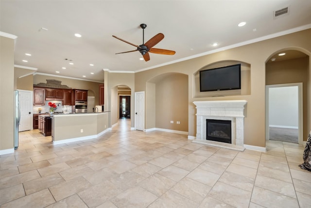 unfurnished living room featuring recessed lighting, visible vents, a ceiling fan, a high end fireplace, and baseboards