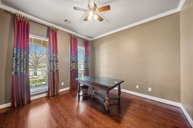 office with ornamental molding, visible vents, baseboards, and wood finished floors