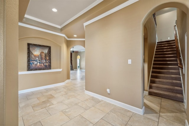 2405 Pebble Lodge Ln, Friendswood, TX 77546 - hall featuring arched walkways, recessed lighting, crown molding, baseboards, and stairway
