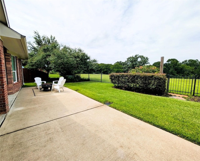 2405 Pebble Lodge Ln, Friendswood, TX 77546 - view of patio / terrace with a fire pit