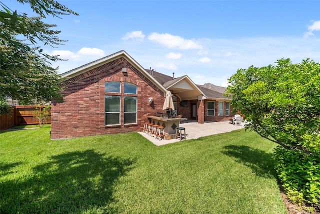 2405 Pebble Lodge Ln, Friendswood, TX 77546 - back of property with brick siding and a patio area