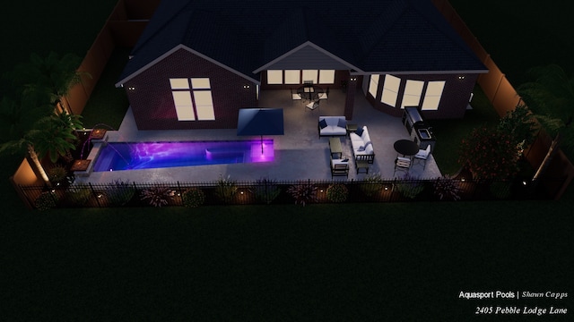 2405 Pebble Lodge Ln, Friendswood, TX 77546 - back of house at night featuring a fenced backyard and a patio