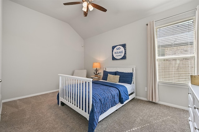 carpeted bedroom featuring lofted ceiling, multiple windows, and baseboards