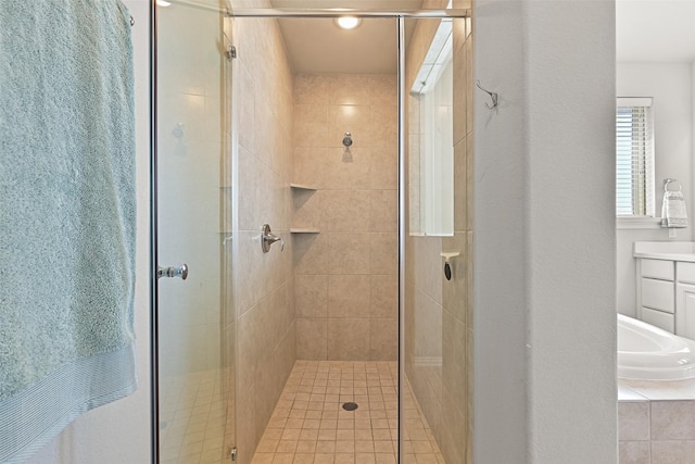 full bathroom featuring a stall shower and vanity