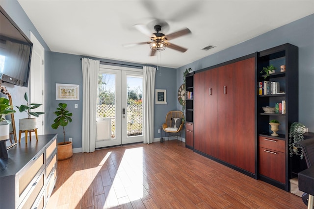 doorway with ceiling fan, french doors, dark wood-type flooring, and visible vents