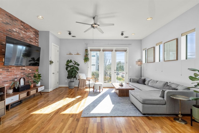 living area featuring visible vents, baseboards, ceiling fan, wood finished floors, and recessed lighting