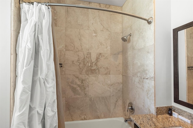 full bathroom featuring shower / bathtub combination with curtain and vanity