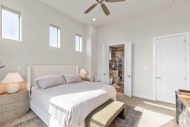 bedroom featuring recessed lighting, a ceiling fan, light carpet, connected bathroom, and baseboards