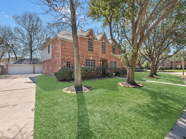 view of side of home featuring a garage, a yard, an outbuilding, and brick siding