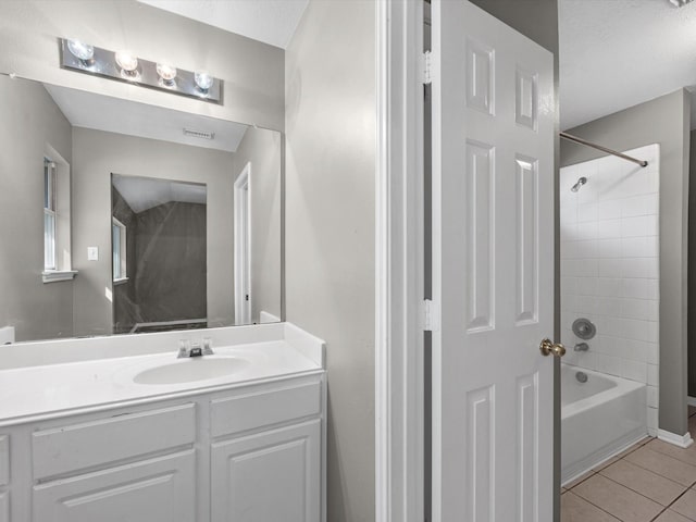 bathroom with visible vents, vanity, shower / bathtub combination, and tile patterned floors