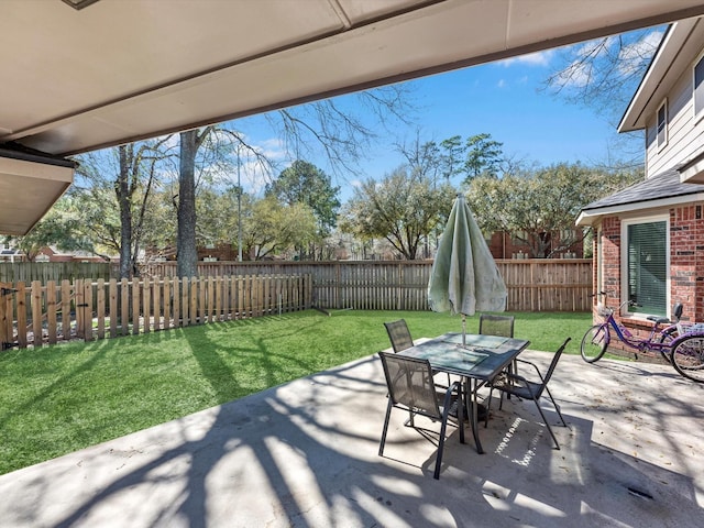 view of patio / terrace with outdoor dining area and a fenced backyard