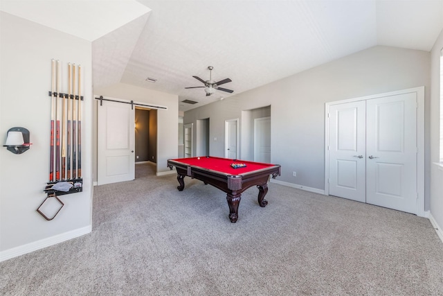 game room with a barn door, carpet floors, a ceiling fan, baseboards, and vaulted ceiling