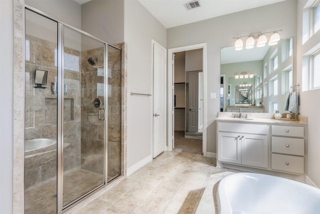 bathroom with a shower stall, visible vents, baseboards, and vanity