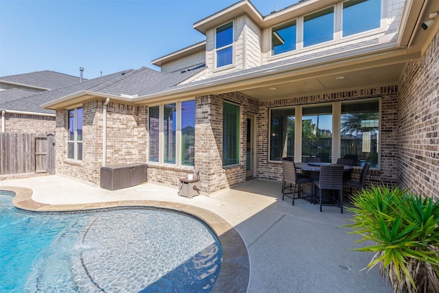 view of pool featuring fence, a fenced in pool, and a patio