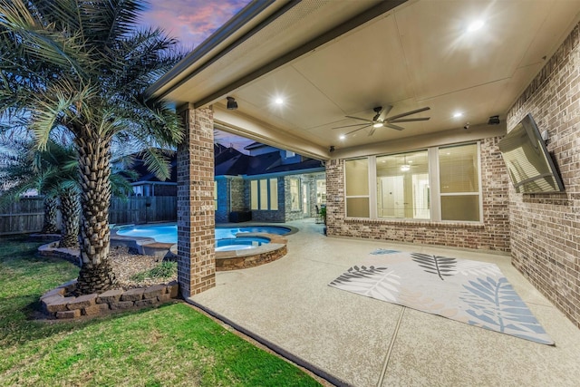 view of patio / terrace featuring a ceiling fan, a fenced in pool, a fenced backyard, and an in ground hot tub