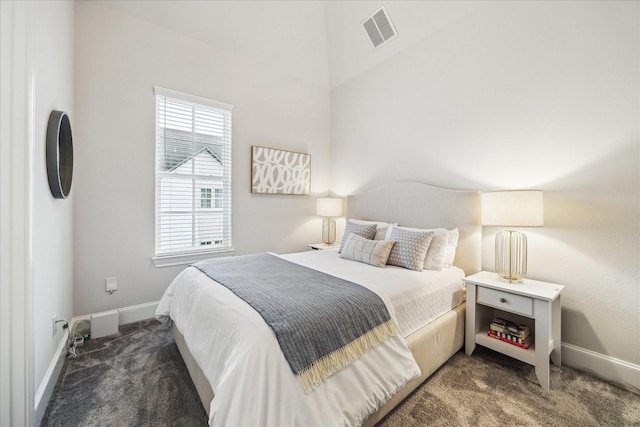 carpeted bedroom featuring visible vents and baseboards