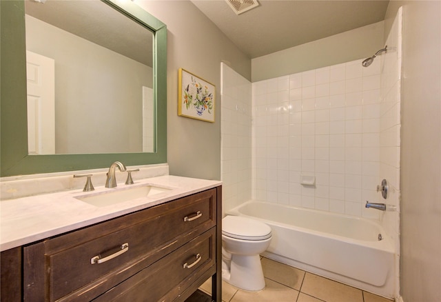 bathroom featuring shower / washtub combination, visible vents, toilet, vanity, and tile patterned flooring