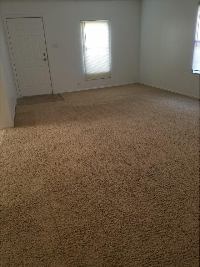 spare room with carpet floors