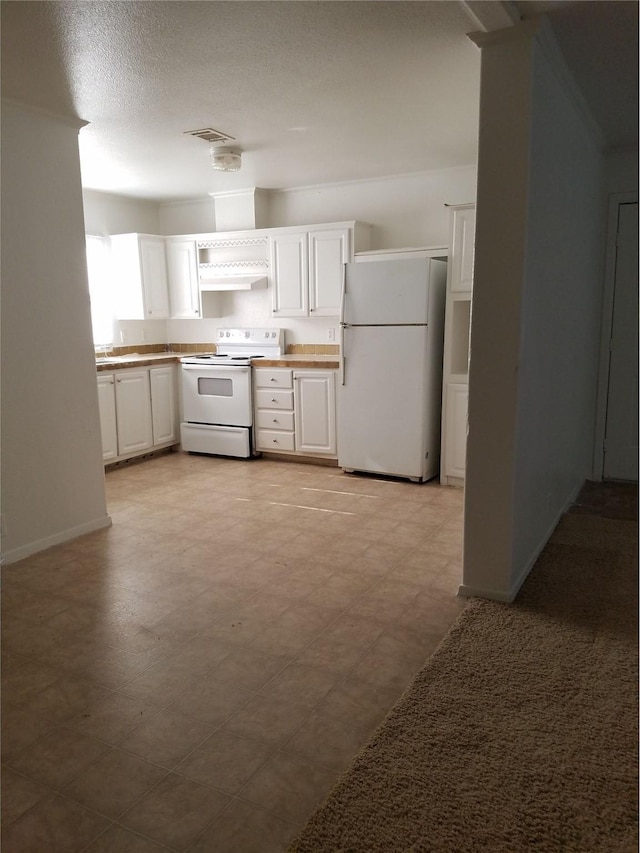 kitchen with under cabinet range hood, light floors, white appliances, and white cabinets