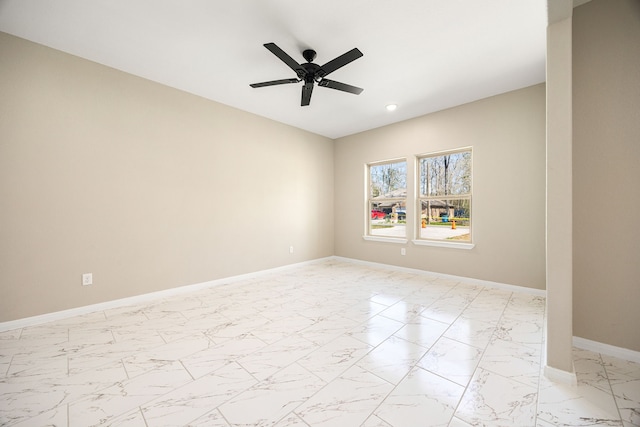 unfurnished room with marble finish floor, ceiling fan, baseboards, and recessed lighting