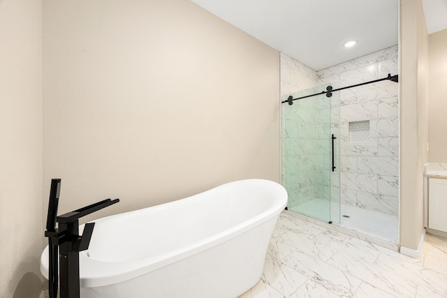 full bath with marble finish floor, a marble finish shower, recessed lighting, a soaking tub, and baseboards