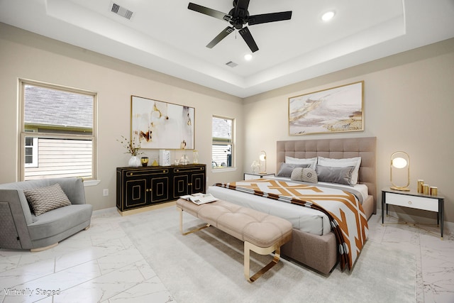 bedroom with recessed lighting, a raised ceiling, visible vents, and baseboards