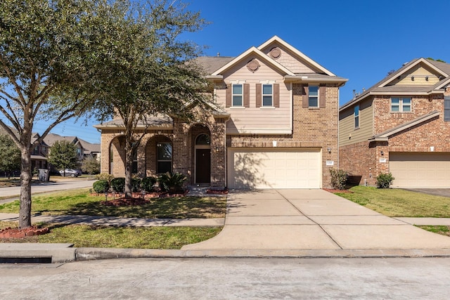 view of front of house with a garage, driveway, and brick siding