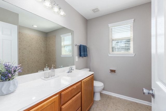 full bath featuring baseboards, visible vents, toilet, tile patterned flooring, and vanity