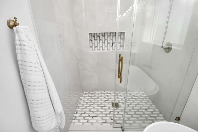 full bathroom featuring a shower stall